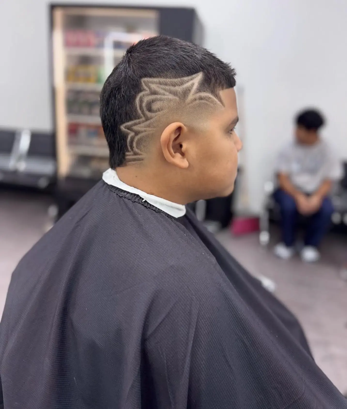 Young client with a clean skin fade and sharp lineup